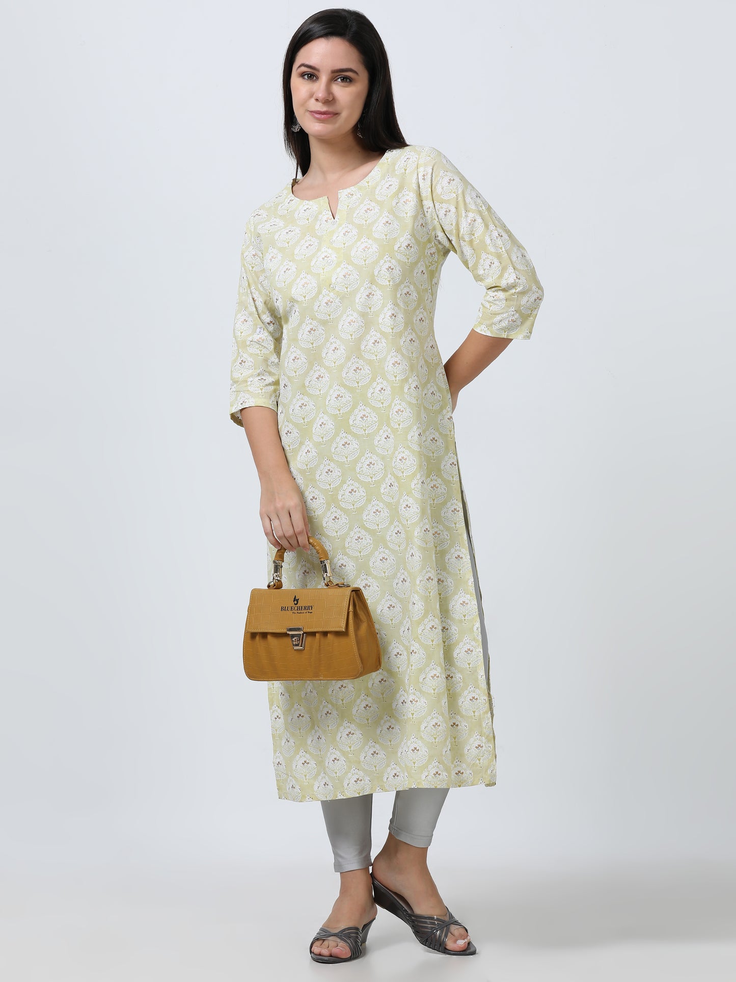 Side view of the Pastel Foil Print Cotton Kurti, emphasizing its flattering fit and the soft, pastel shade with foil accents.