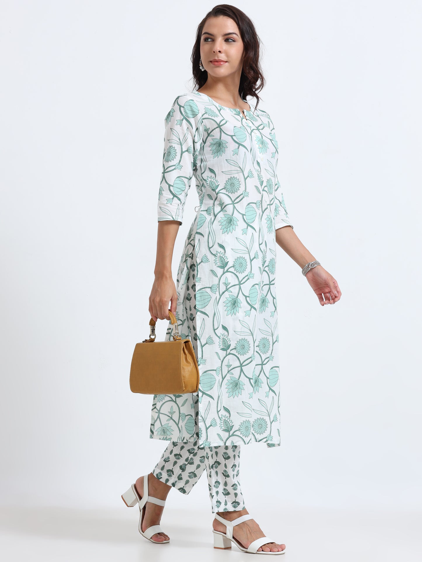 Side view of Cyan Floral Kurti Set, highlighting breathable fabric with beautiful floral accents.