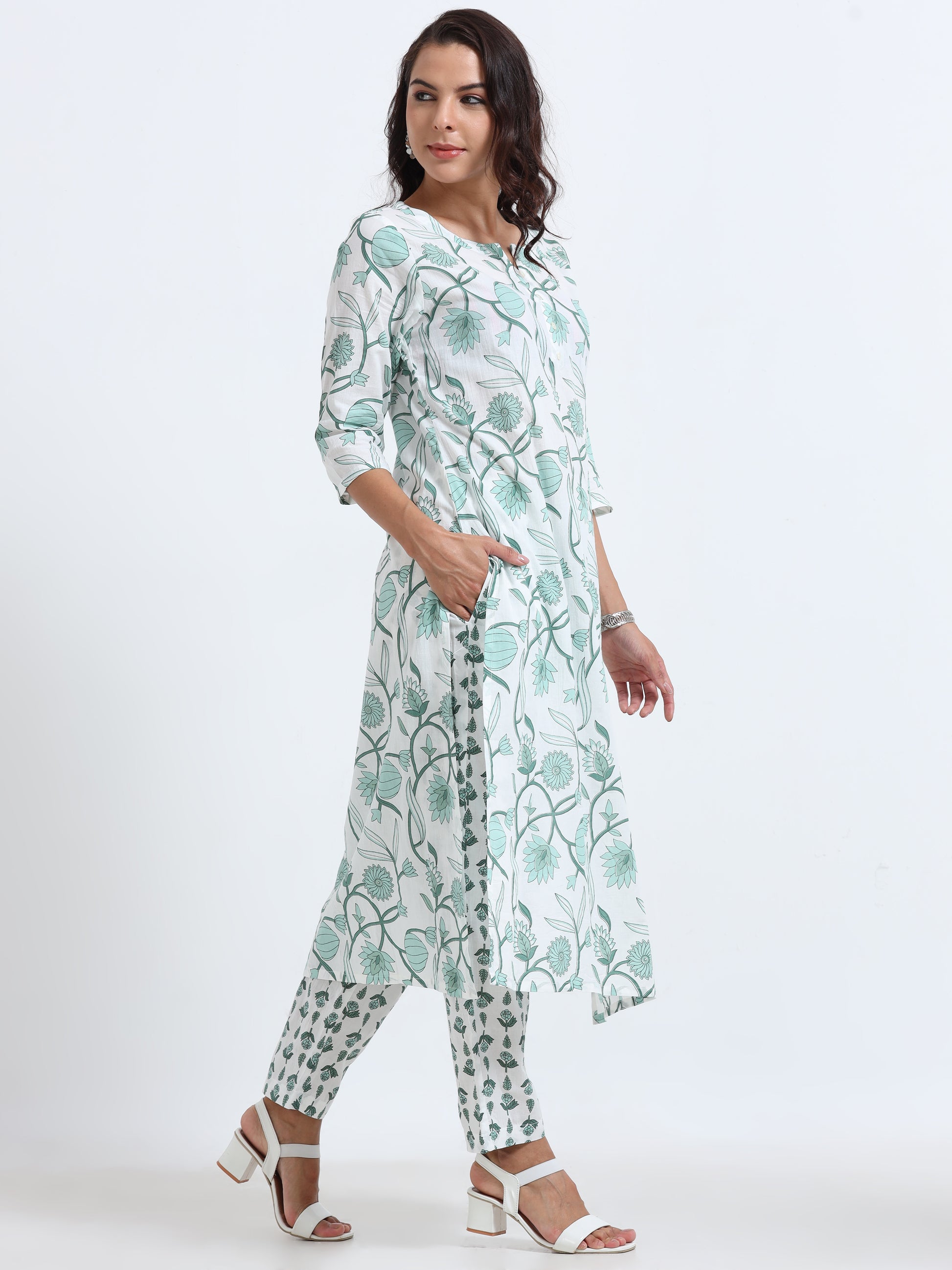 Model wearing Cyan Floral Kurti Set with elegant floral design, showcasing a vibrant and stylish ethnic look.