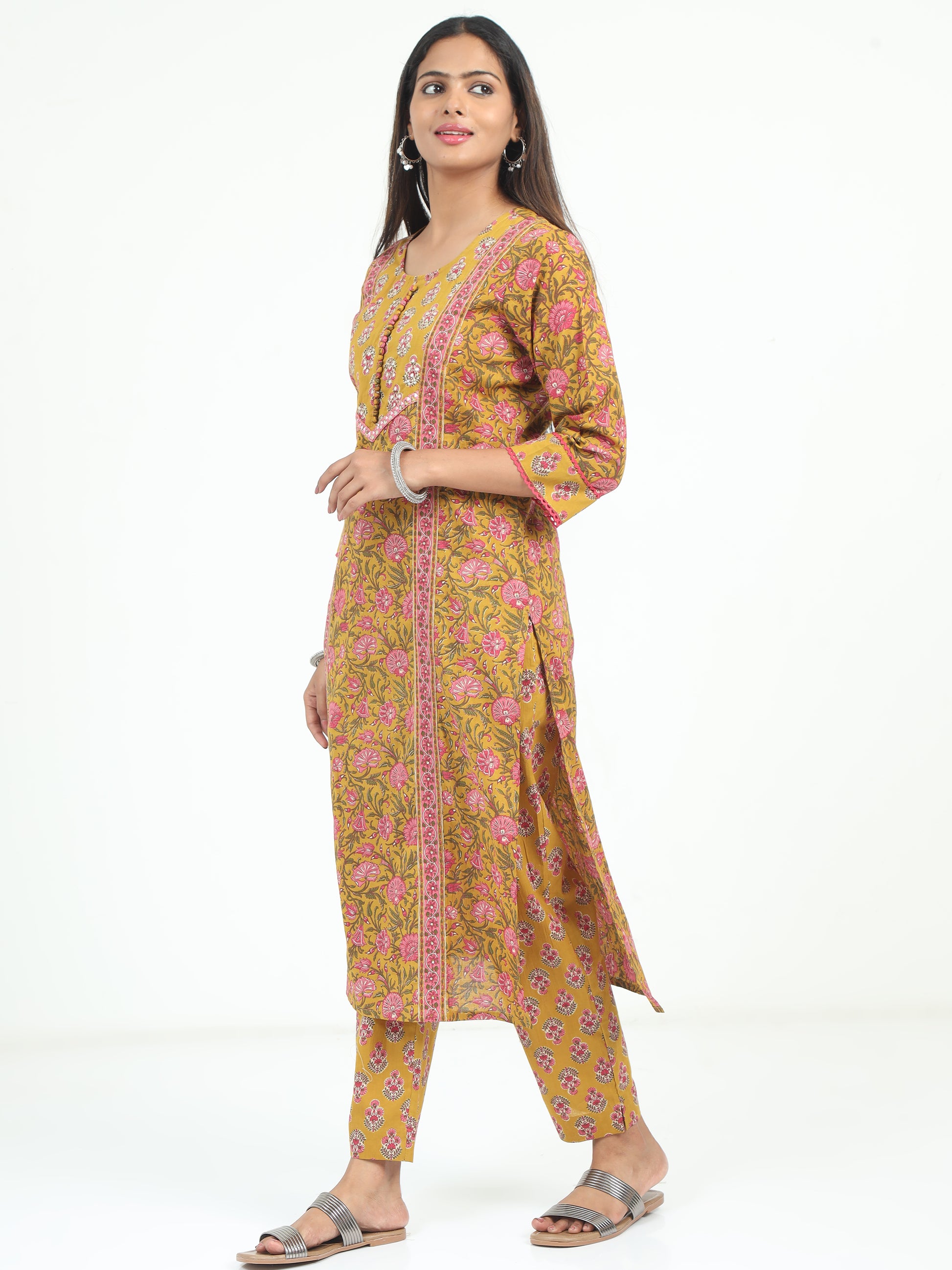 Side view of the Mustard Floral Kurti, highlighting the delicate floral design and flattering silhouette.