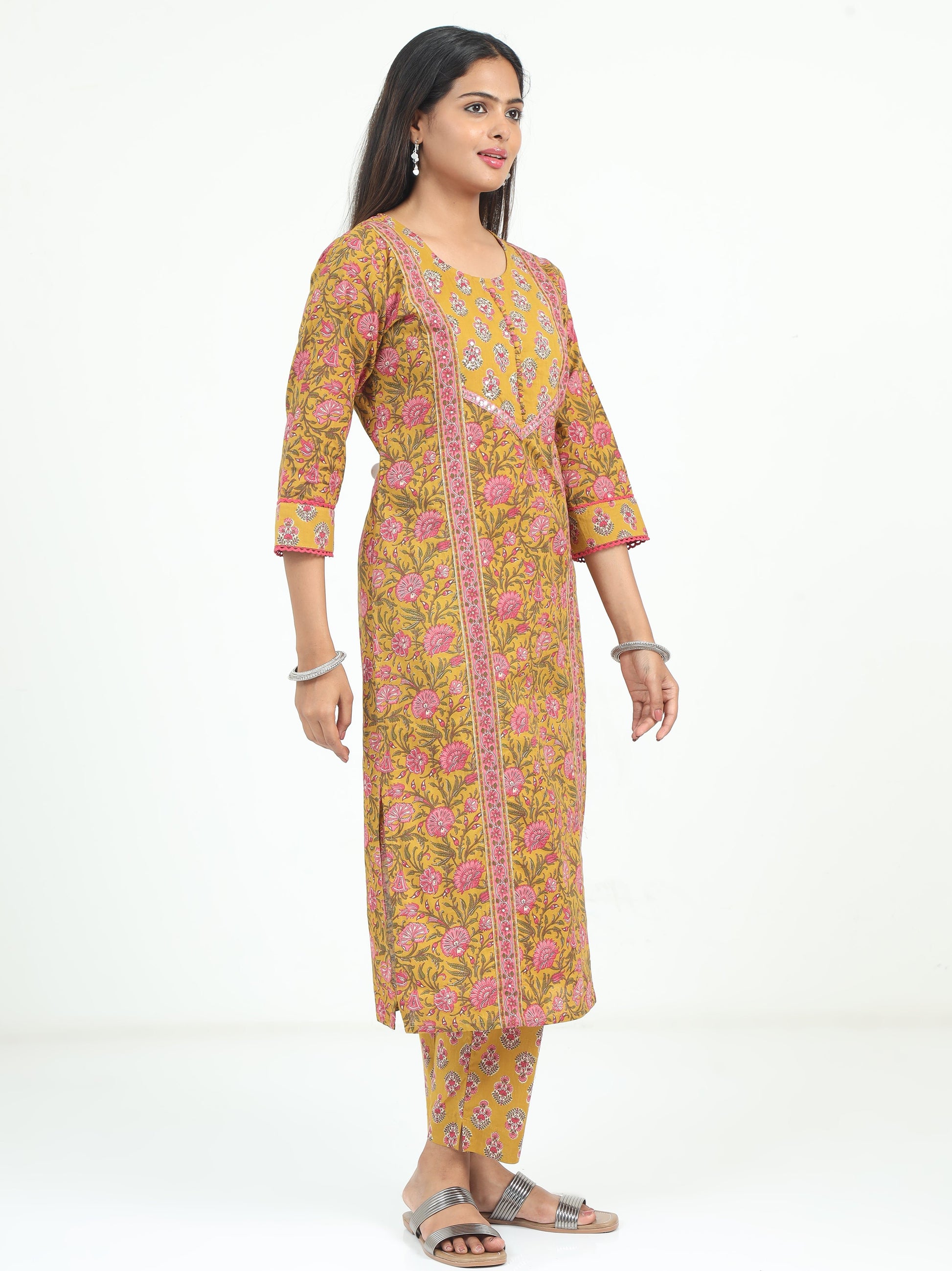 Stylish Mustard Floral Kurti with matching accessories, blending traditional charm with modern fashion.