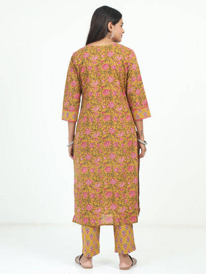 Elegant Mustard Floral Kurti set against a light background, emphasizing its vibrant floral pattern and soft, breathable fabric.