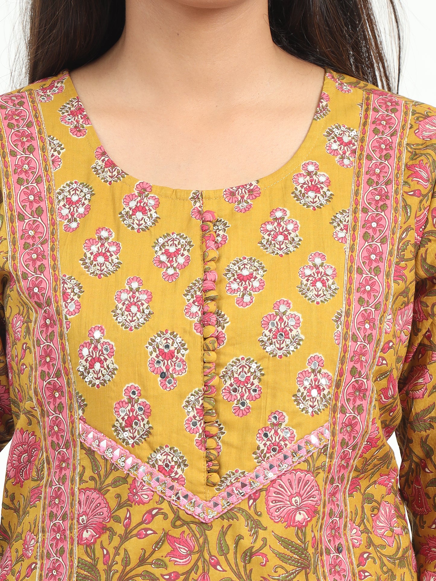 Elegant Mustard Floral Kurti set against a light background, emphasizing its vibrant floral pattern and soft, breathable fabric.