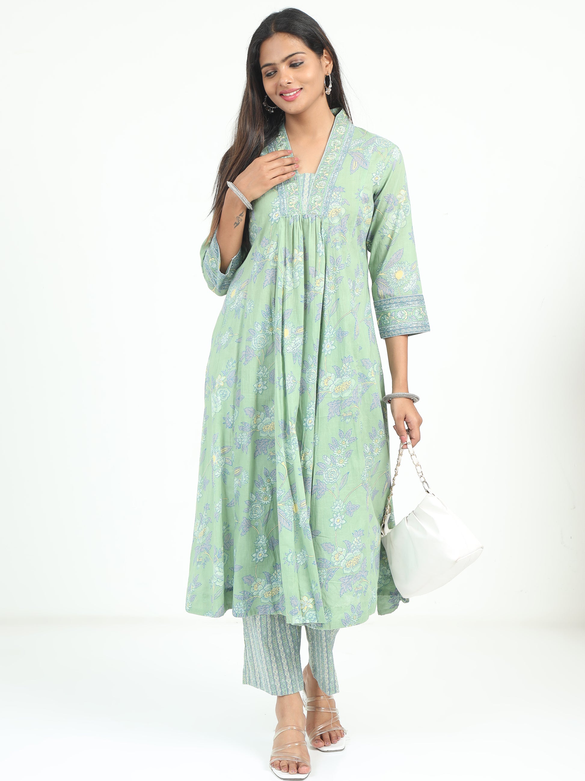 Model wearing Teal Floral Kurti with intricate floral patterns, offering a blend of elegance and modern style.