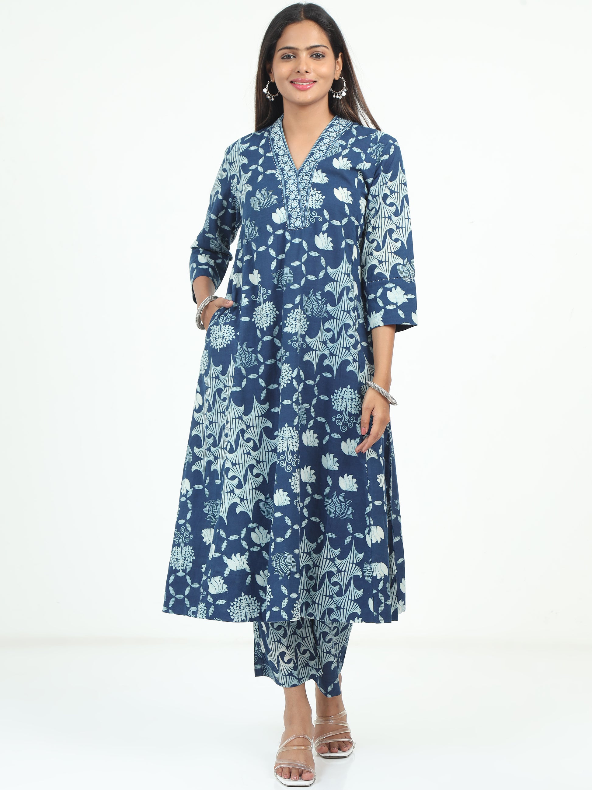 Model wearing Blue Floral Kurti and Pant Set with vibrant floral pattern, perfect for casual and festive wear.