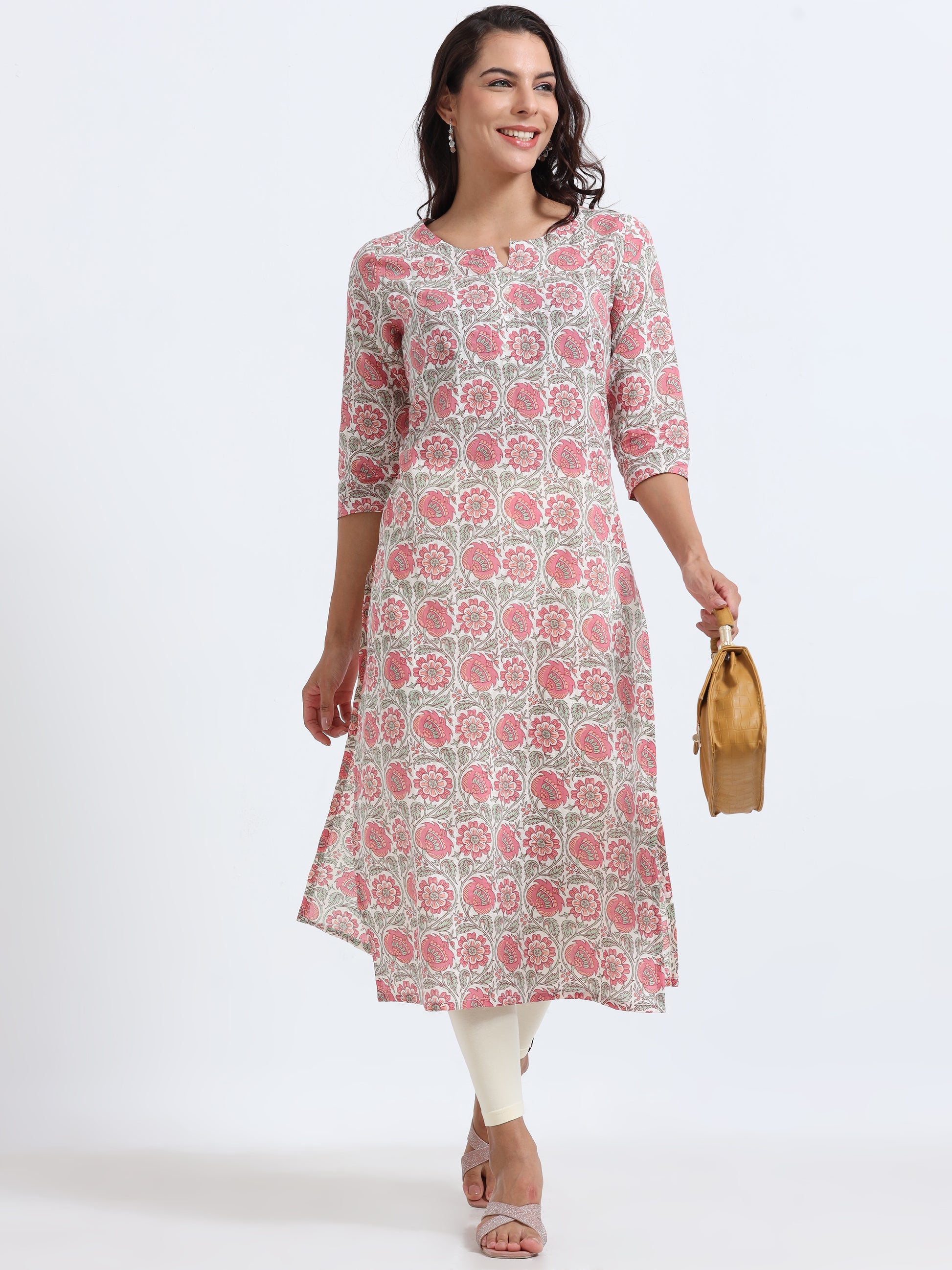 Close-up of floral design on Blushing Pink Kurti, highlighting intricate pink and white flower patterns.