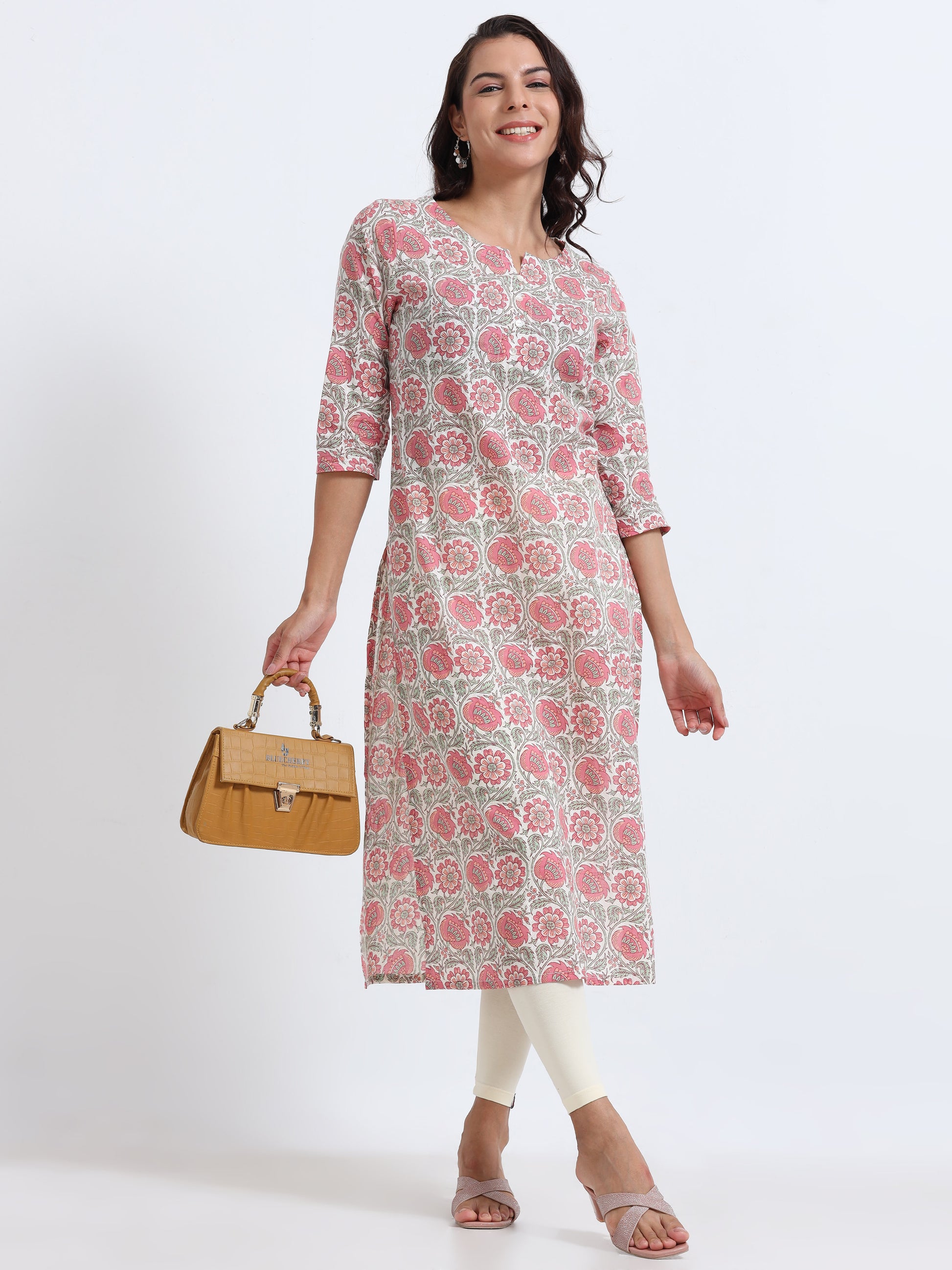 Model wearing Blushing Pink Floral Kurti with delicate floral print, a blend of elegance and comfort.