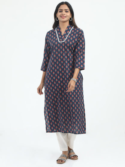 Model wearing Indigo Floral Print Cotton Kurti with a rich blue hue and intricate floral patterns for a timeless ethnic look.