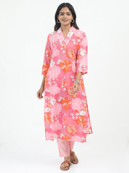 A model showcasing the Premium Cotton Pink Floral Kurti Set with Lycra Pant, featuring a vibrant floral design and a comfortable, flattering fit.