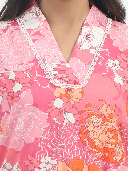 Detailed shot of the floral print on the Premium Cotton Pink Floral Kurti Set with Lycra Pant, showcasing the intricate design and quality cotton fabric.